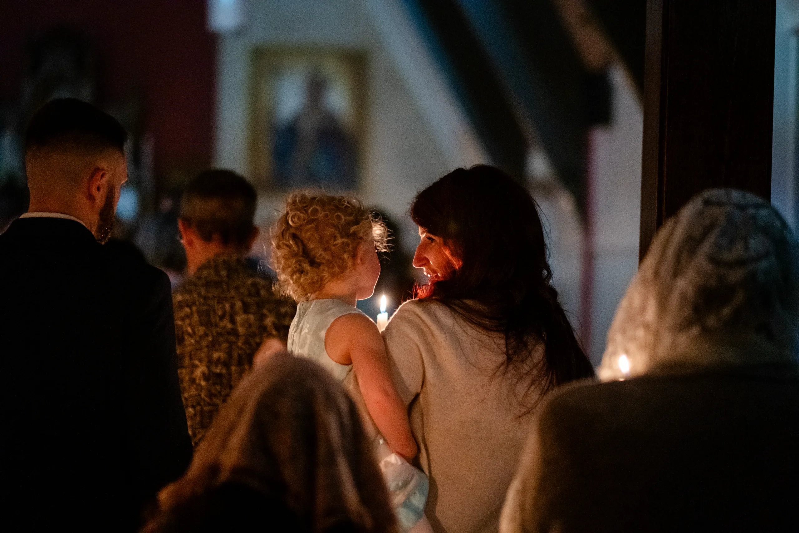 Mother And Child Holding A Candle